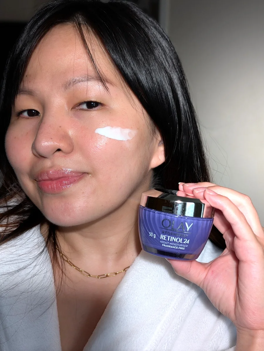 Mary Jane demonstrating a retinol cream product